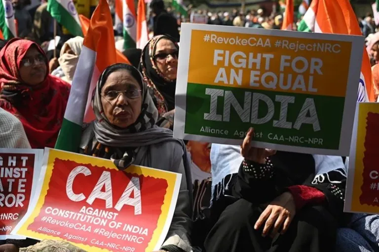 Protesters hold placards as they demonstrate against India's citizenship law in New Delhi